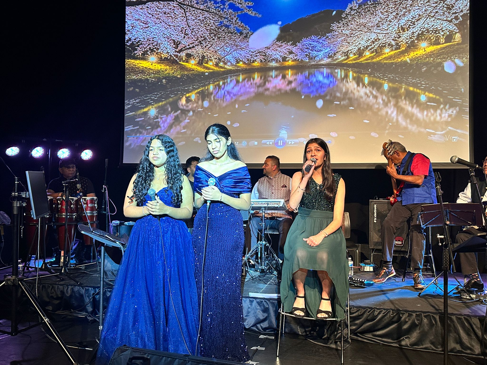 Group of singers performing on stage